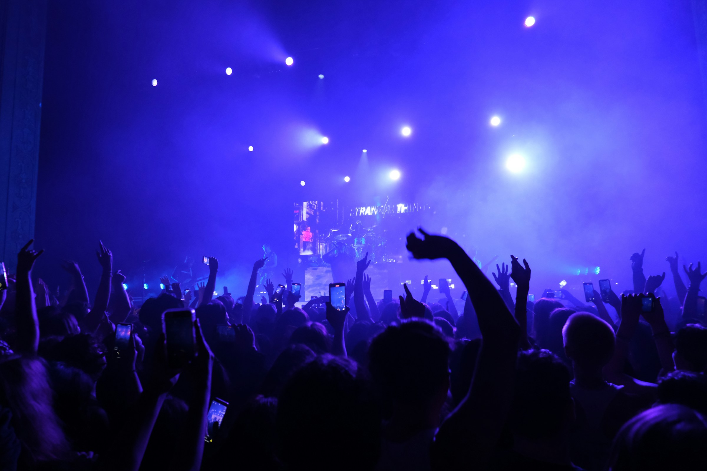 A live performance with violet stage lighting